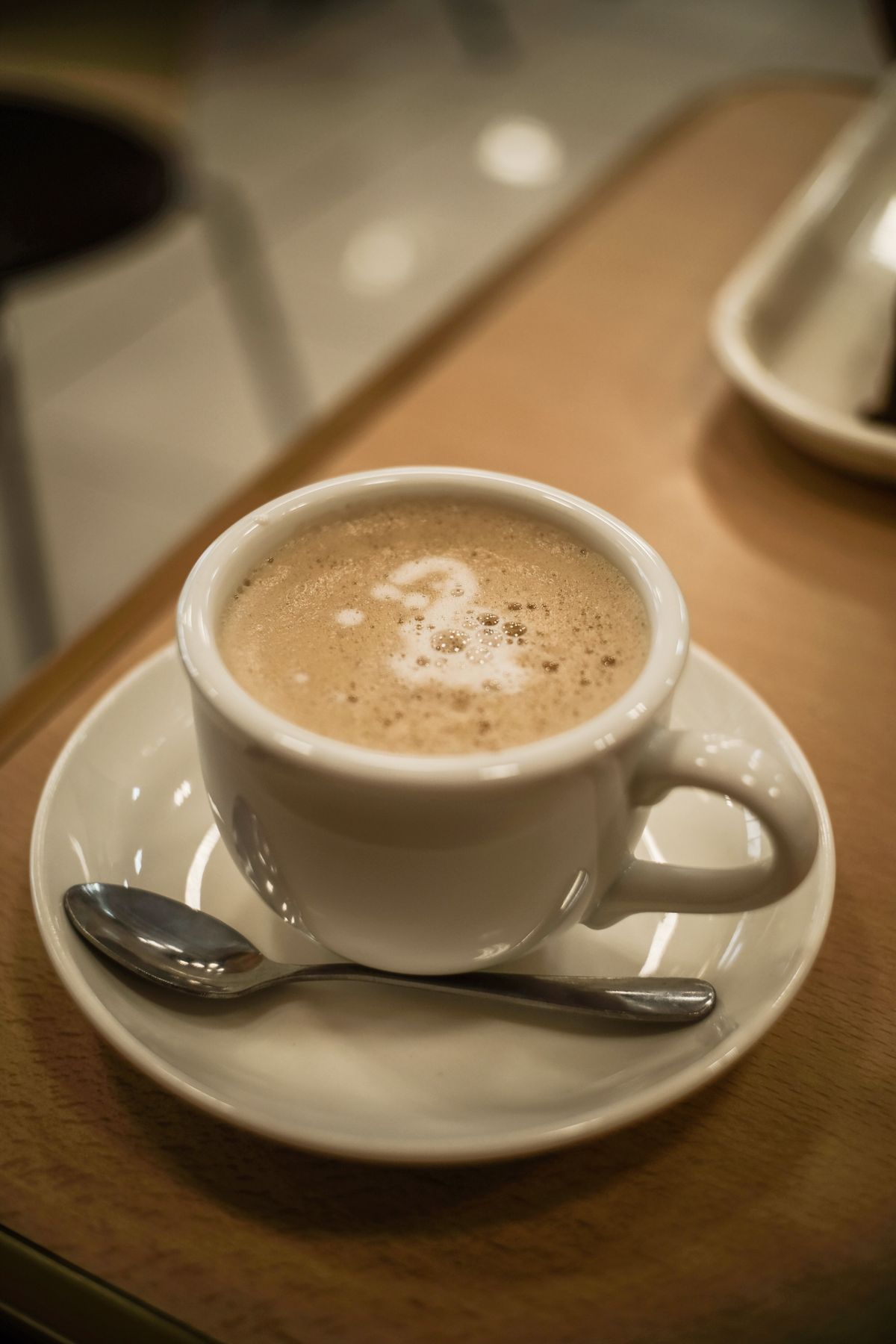 A cup of coffee on a wooden table